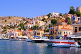 Naklejki Colorful harbor with boats at Symi, Greece