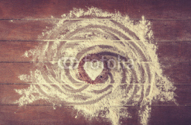 Naklejki Heart shape cake on wooden table