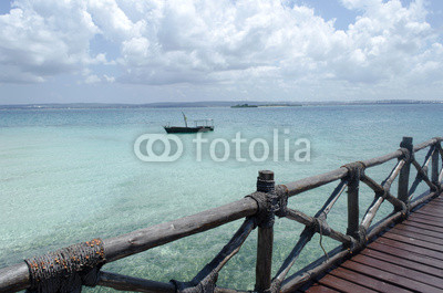 Wooden boat on turquoise water in Zanzibar, Tanzania, Africa