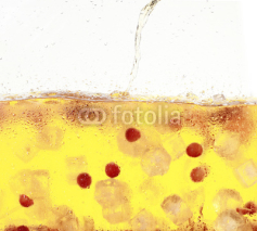 Fototapety A tank of cold white wine punch with grapes, ice, and fruit