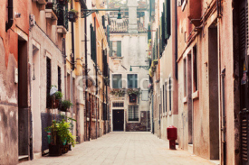 Naklejki A narrow, old street in Venice, Italy