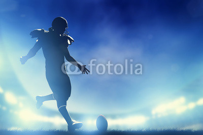 American football player kicking the ball, kickoff