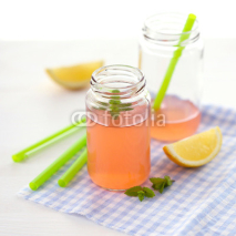 Naklejki Grapefruit drink with lemon and mint