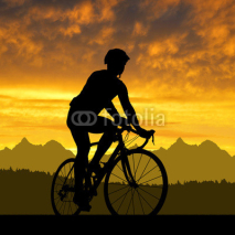Naklejki silhouette of the cyclist riding a road bike at sunset