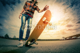 Obrazy i plakaty Young lady with skateboard
