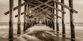 Fototapety "Sepia Smooth"  The Ocean Isle Beach Pier is quiet in January. The Atlantic Coast of North Carolina is surreal and peaceful in the off season. 
