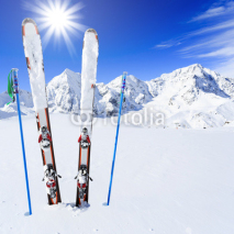 Obrazy i plakaty Skiing, winter season , mountains and ski equipments on ski run