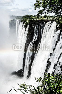 Rainbow over Victoria Falls on Zambezi River