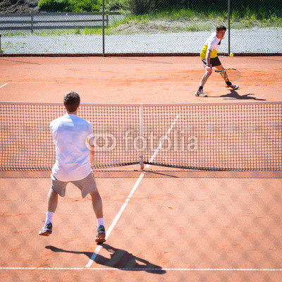 male tennis match competition on sand court