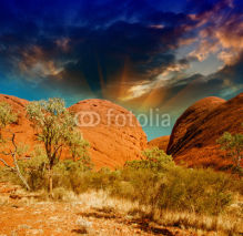 Beautiful rocks of Australian Outback against colourful sky