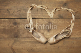 Fototapety Two Ballet Shoes on Wooden Floor