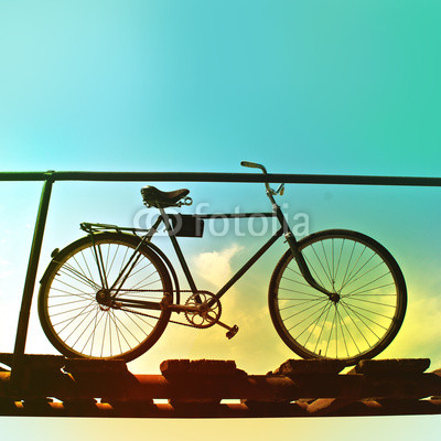 Retro bike on an old wooden bridge.