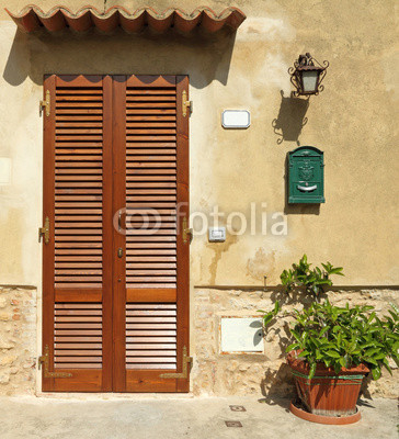blinded door to the tuscan house