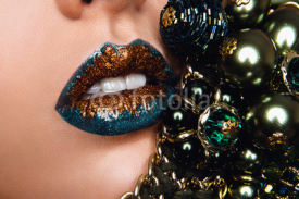 Naklejki Blue and golden lips with jewelry. Make up