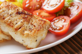 Fototapety roasted codfish fillet with vegetables