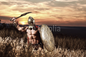 Warrior in helmet with bare torso going in attack.