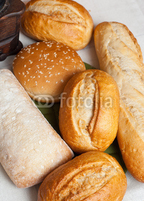 Mix of freshly baked rolls on cotton cloth