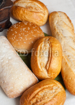 Naklejki Mix of freshly baked rolls on cotton cloth