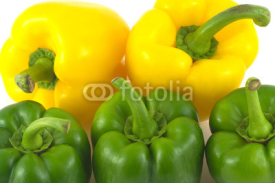 Naklejki Two yellow and three green sweet bell peppers isolated