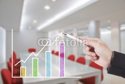 hand writing graph in conference room