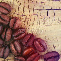 Obrazy i plakaty Coffee Beans on Old Wooden Background.