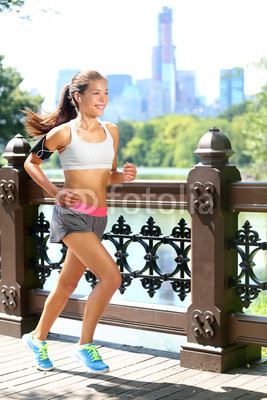 Running woman jogging to music in New York City