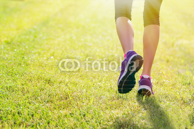 Woman running outdoors in morning