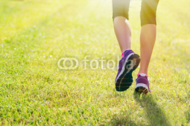 Naklejki Woman running outdoors in morning
