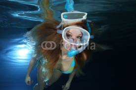 Naklejki Female snorkeler underwater