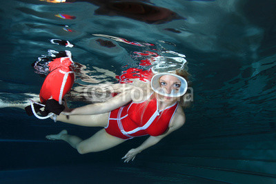 Lifeguard with red swimsuit and diving mask 