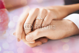 Fototapety close up of couple hands with engagement ring
