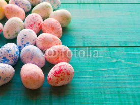 Naklejki Easter eggs on wooden background