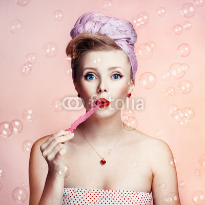 Beautiful young sexy pin-up girl with surprised expression