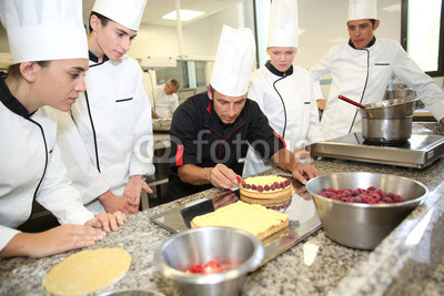 Students with teacher in pastry training course