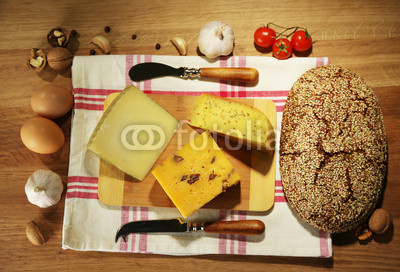 Still life with dairy products and bread on wooden table
