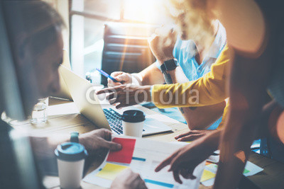 Young Group Coworkers Making Great Business Decisions.Marketing Team Discussion Corporate Work Concept Studio.New Startup Creative Idea Presentation Laptop.People Working Wood Table Documents.Blurred.