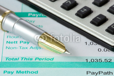pen,calculator and payslip