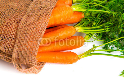 Fresh carrots in juta bag