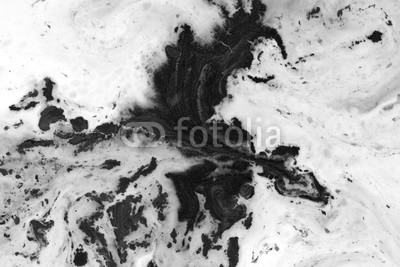 Black and white background with ink on milk texture
