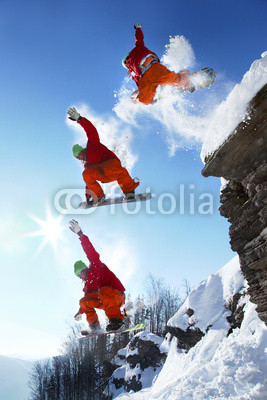 The whole jump of Snowboarder from the rock in mountains