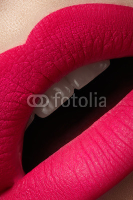 Full woman's lips with bright fashion mat pink makeup