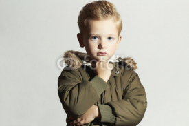 Naklejki child in winter coat. fashion kids.little boy hairstyle