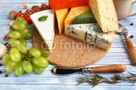 Naklejki Different Italian cheese on wooden table