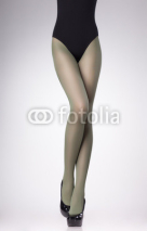 Naklejki stockings on sexy woman legs isolated on grey