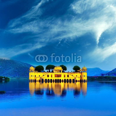 Indian water palace on Jal Mahal lake at night time in Jaipur, I