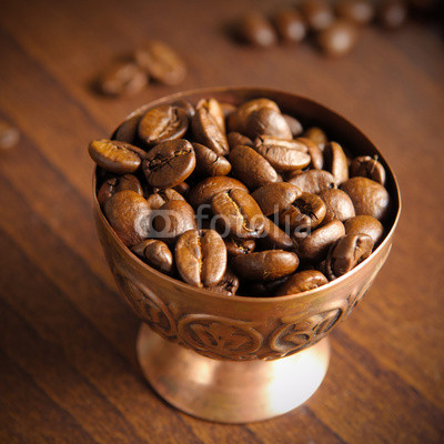 coffee beans in copper cup