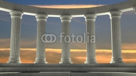 Naklejki Ancient marble pillars in elliptical arrangement with orange sky
