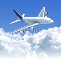 Fototapety airplane flying over the clouds 