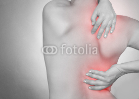 Fototapety Frau mit Rückenschmerzen