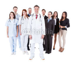 Naklejki Doctor standing in front of his team